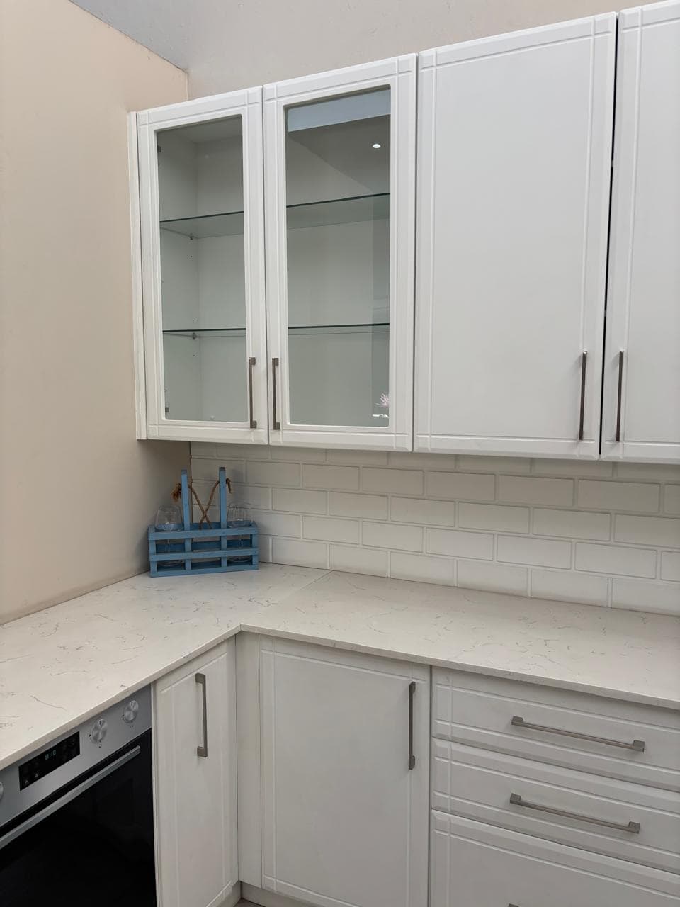 White shaker kitchen with marble countertops